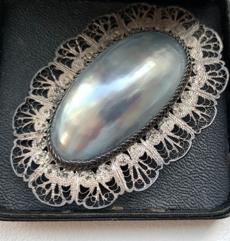 Antique Edwardian Romantic Rare Oversized Shimmering Mother of Pearl Brooch with Hand Wrought Silver Filigree Surround