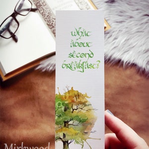 May include: A white bookmark with green calligraphy that reads "What about second breakfast?" and a watercolor painting of a tree with green and yellow leaves. The bookmark has the text "Mirkwood Scribes" at the bottom.