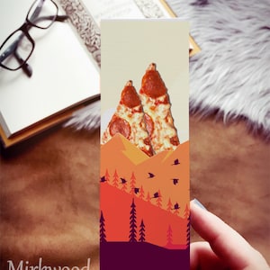 May include: A bookmark featuring a mountain range with a sunset sky and a pepperoni pizza slice on top. The bookmark has the text "Mirkwood Scribes" at the bottom.