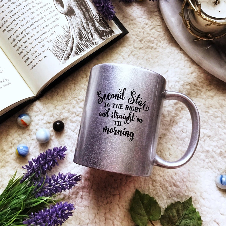 May include: A silver glitter mug with a black design that reads "Second Star to the Right and straight on til morning".