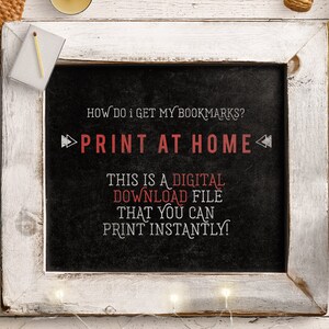 May include: A chalkboard with white trim, sitting on a wooden surface. The chalkboard has the text "HOW DO I GET MY BOOKMARKS? PRINT AT HOME" written in white chalk. Below the text is a message in red chalk that says "THIS IS A DIGITAL DOWNLOAD FILE THAT YOU CAN PRINT INSTANTLY!"