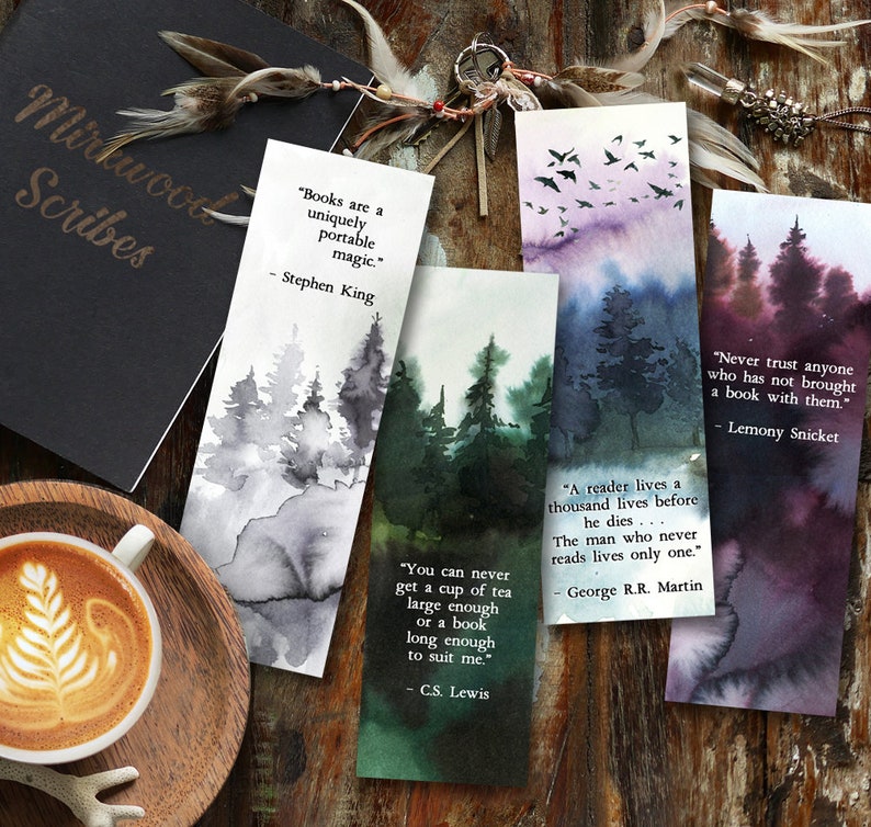 May include: Four watercolor bookmarks with forest scenes and inspirational quotes. The quotes are by Stephen King, C.S. Lewis, George R.R. Martin, and Lemony Snicket.