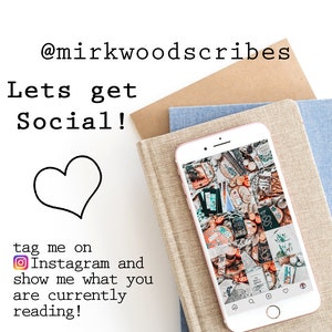 May include: A close-up of a smartphone displaying a collage of images on the screen. The phone is resting on a stack of books with a brown, beige, and blue fabric cover. The text "@mirkwoodscribes Lets get Social!" is written in black text on a white background. The text "tag me on Instagram and show me what you are currently reading!" is written in black text on a white background. A black heart symbol is below the text.