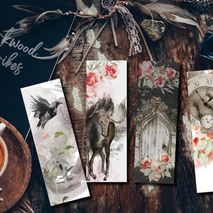 May include: Set of four watercolour bookmarks featuring a black crow, a white unicorn, a vintage door, and a clock with floral accents. The bookmarks are printed on white paper and have a watercolour effect.