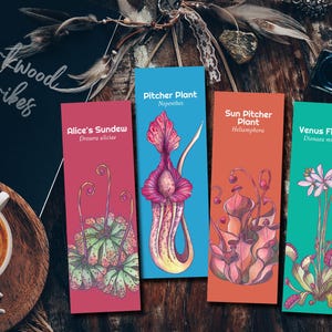 May include: Four colourful botanical bookmarks featuring illustrations of carnivorous plants: Alice's Sundew, Pitcher Plant, Sun Pitcher Plant, and Venus Flytrap. The bookmarks are set against a dark wooden background with a cup of coffee and the text "Mirkwood Scribes".
