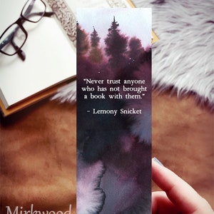 May include: A dark purple and black watercolor bookmark with a quote from Lemony Snicket: "Never trust anyone who has not brought a book with them."