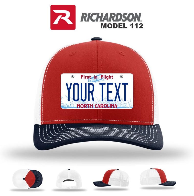 May include: A red, white, and navy blue Richardson Model 112 trucker hat. The hat features a white mesh back, a red front panel, and a navy blue brim. A rectangular patch on the front displays the text "YOUR TEXT" above "NORTH CAROLINA".