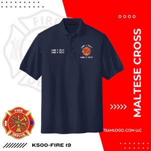 May include: A navy blue polo shirt with a white Maltese cross embroidered on the left chest. The cross features a red fire department logo with a firefighter's helmet, axe, and hose. The text "LINE 1 TEXT", "LINE 2 TEXT", "LINE 3 TEXT", and "LINE 4 TEXT" is embroidered below the cross. The text "K500-FIRE 19" is printed below the shirt.