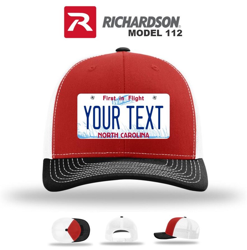 May include: A red, white, and black Richardson Model 112 trucker hat with a custom license plate design. The license plate reads "YOUR TEXT" with "First in Flight" above and "NORTH CAROLINA" below. The hat has a curved brim.