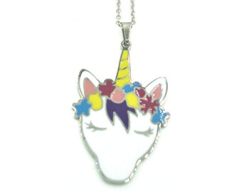 May include: A silver chain necklace with a white unicorn pendant. The unicorn has a yellow horn, purple mane, and a flower crown with pink, yellow, blue, and red flowers.