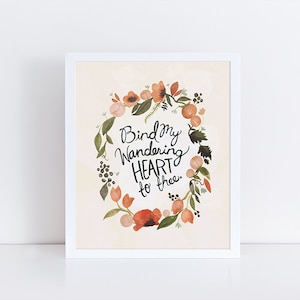 May include: A white framed print with a floral wreath and the text "Bind my wandering HEART to thee."