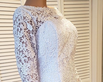 Lovely and elegant heavy white lace, low v-back, boat neck, long sleeve wedding gown