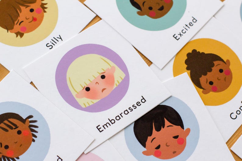 May include: Cards with illustrations of children's faces expressing different emotions. The cards have text labels such as "Embarrassed" and "Excited". The illustrations are in a circular design with a white background.
