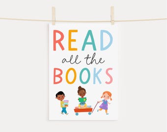 May include: A colorful printable poster with the text "READ all the BOOKS" and an illustration of three children with books. The children are pulling a red wagon full of books.