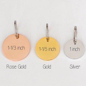 May include: Three round pet tags in rose gold, gold, and silver. The rose gold tag is 1-1/3 inches, the gold tag is 1-1/5 inches, and the silver tag is 1 inch. Each tag has a silver ring for attachment, with the tag colors labeled below.