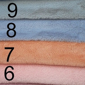 Soft miniature faux fur fabric for miniature teddy bear making .