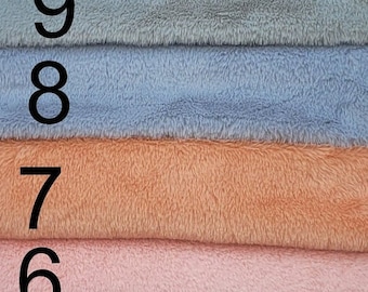 Soft miniature faux fur fabric for miniature teddy bear making .