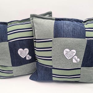 May include: Two patchwork cushions made from denim, green and grey fabric. One cushion has a heart-shaped patch that says "Dad". The other cushion has a heart-shaped patch that says "Grandad". Both cushions have an embroidered quote.
