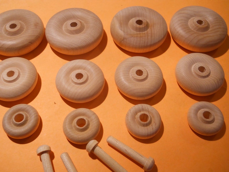 Four Wooden Toy Wheels And Axles Image 0