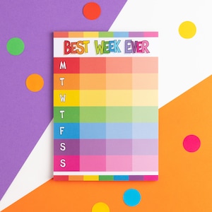 以下が含まれることがあります： 虹色の週間プランナーで、上部に「BEST WEEK EVER」というテキストがあります。プランナーには、月曜日から日曜日までの週の各日にスペースがあります。
