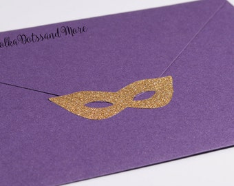 May include: Purple envelope with a gold glitter mask sticker. The envelope has the text "Polka Dotssand More" printed on the front.