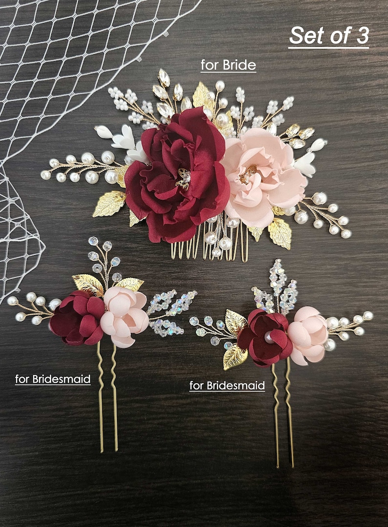 May include: Set of three burgundy and blush floral hair combs with gold accents and pearl embellishments. The larger comb is for a bride and the two smaller combs are for bridesmaids. "Set of 3" is written in the top right corner of the image. "for Bride" is written in the top center of the image. "for Bridesmaid" is written in the bottom left corner of the image. "for Bridesmaid" is written in the bottom right corner of the image.