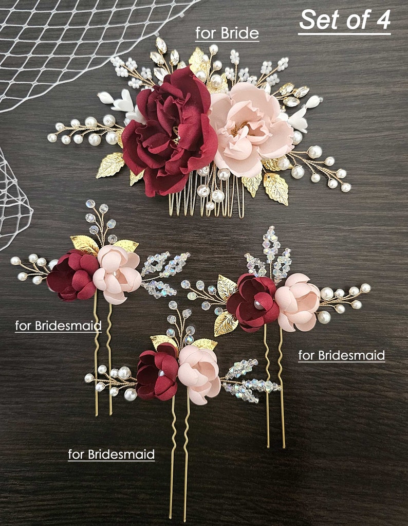 May include: Set of four gold hair combs with burgundy and blush pink fabric flowers, pearls, and crystals. The larger comb is labelled "for Bride" and the smaller combs are labelled "for Bridesmaid".
