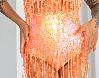 Sunset orange sequin booty shorts. Perfect for festival outfit and sparkly rave wear. Great for pole dance wear and burlesque costume.