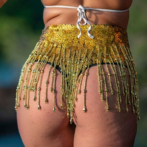 Cheeky G-string low waist sequin shorts in gold sequins. Perfect for festival outfit, sparkly rave and party wear.