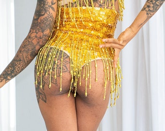 High waist sequin shorts in gold sequins in our new cheeky thong cut. Perfect for the best festival outfit, sparkly rave and party wear.