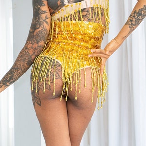 High waist sequin shorts in gold sequins in our new cheeky thong cut. Perfect for the best festival outfit, sparkly rave and party wear.