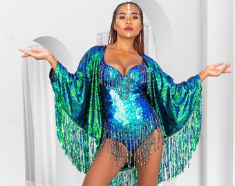 Emerald green sequin kimono with sequin fringe. Light, floaty material for the perfect festival outfit or glamorous beach cover up.