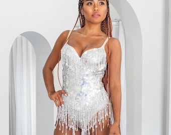 Silver, sparkly, sequin bodysuit for women. This sequin leotard is perfect for festival outfit, rave wear, glamorous party wear.