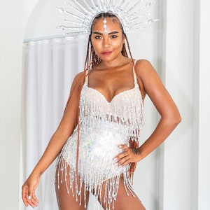 Silver sequin booty shorts for women with beads. Perfect festival outfit, sparkly rave and party wear.