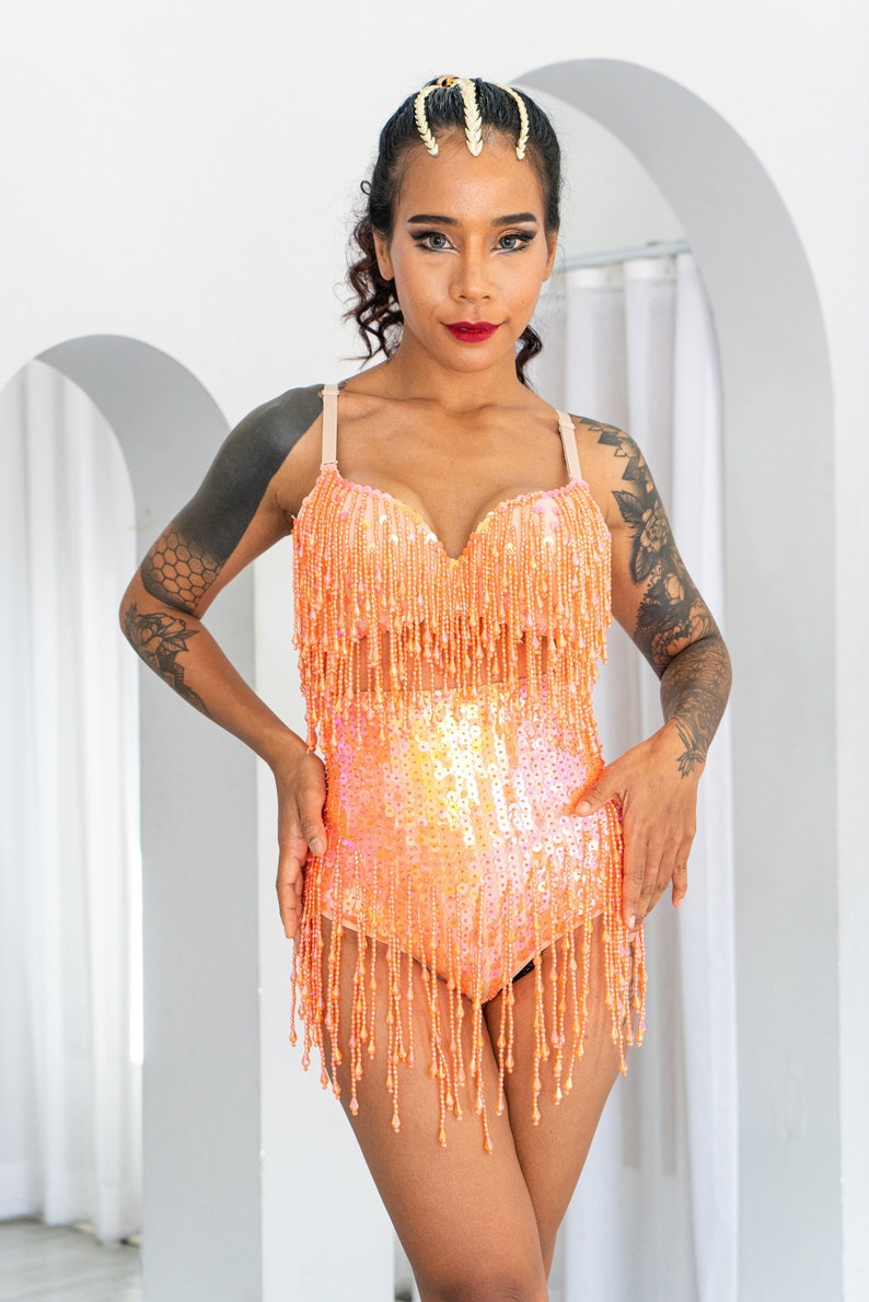 Sunset orange sequin booty shorts. Perfect for festival outfit and sparkly rave wear. Great for pole dance wear and burlesque costume. image 1