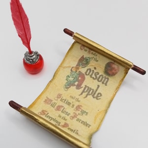 May include: A miniature scroll with a gold background and the words "Waste of the Poison Apple" and "Victim's Eyes Will Close Forever in the Sleeping Death". A red feather quill and inkwell are also pictured.