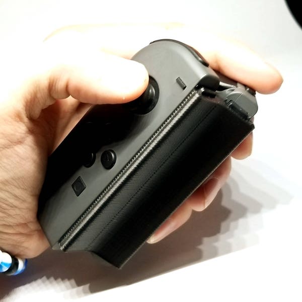 Einhändiger Joy-Con-Griff - Linkshänder - Nintendo Switch - Einfach zu verwendende Handicap-/Behinderungshilfe - Klein und tragbar - Kostenloser Versand mit Sendungsverfolgung
