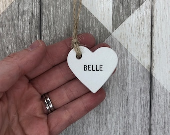 Personalised wedding favours, wedding place names, heart tags, personalised clay tags, table decorations, napkin rings, wedding keepsake.