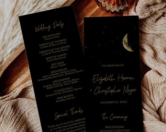 May include: Black wedding ceremony program cards with gold text. The cards feature a moon and stars design. The text includes the names Elizabeth Harren and Christopher Meyer, the wedding date, and the ceremony order.