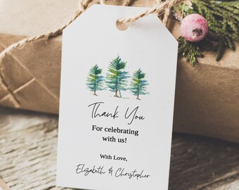May include: A white thank you tag with a watercolor illustration of three green pine trees. The text reads "Thank You" and "For celebrating with us!" with "With Love, Elizabeth & Christopher" at the bottom.