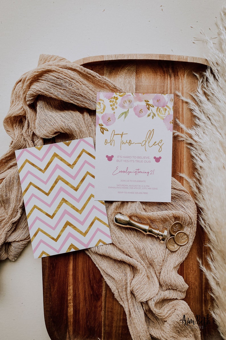 May include: Pink and gold invitation with a floral design and the text "oh two-dles" and "Essalya is turning 21".
