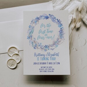May include: A blue and white watercolor wreath with feathers and snowflakes surrounds the text "for the first time in four-ever!"  The text "Brittany Elizabeth is turning four!" is below the wreath. The invitation includes the date and time of the party, the location, and the RSVP information.