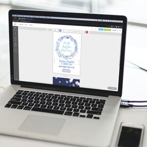 May include: A laptop computer displaying a blue and white invitation with the text "For the first time in four-ever!" and "Brittany Elizabeth is turning four!" The invitation is for a birthday party. The laptop is on a white surface with a white smartphone next to it. The text "Try Before You Buy!" is displayed below the image.