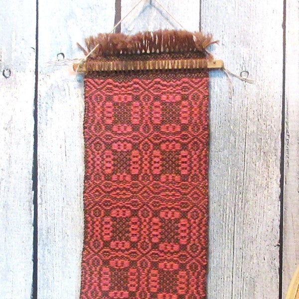 Handwoven small wall hanging. Natural brown and Llama and red wool woven in Whig Rose overshot pattern.  5" by 16" overall