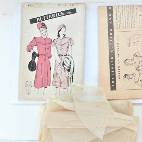 1940s professional women's dress pattern for size 14 bust 32. Butterick #3634, with instruction sheet and 14 pattern pieces. Used complete