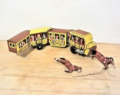 Vintage wind up tin toy. Overland Stage US Mail, features 4 cars pulled by 2 horses. Made in Japan by LineMar Toys. Has condition issues