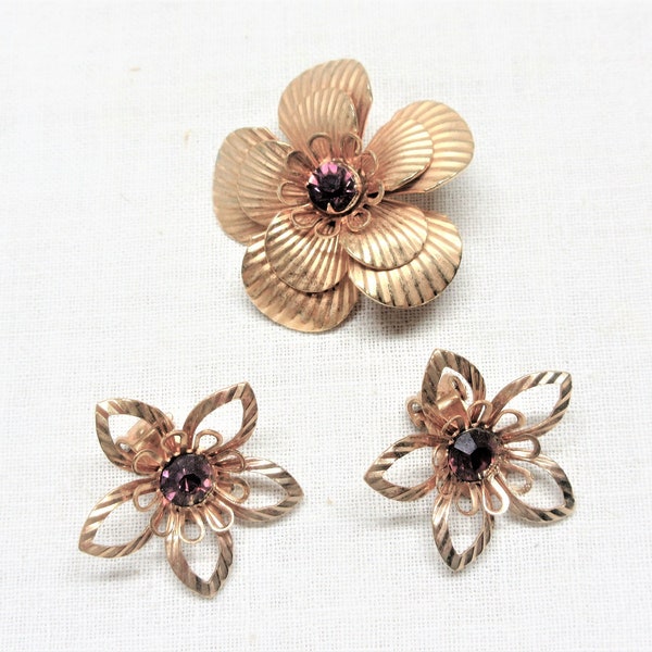 Gold tone parure set. Filigree floral pin and clip on earrings. Good used condition