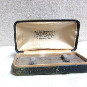Antique empty Paul Gale Greenwood jewelry case: Norfolk, Va. Equipped with a working spring hinged case, has a rusty interior.