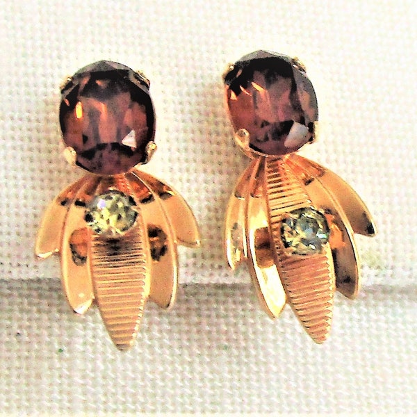 Vintage Van Dell screw back earrings. Gold filled with a large purple glass stone, small white rhinestone About 3/4".