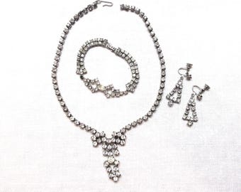 Vintage rhinestone necklace bracelet and screw back earrings set in silver tone metal.